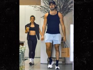 Sam Asghari Oops, I'm Out With the Blonde Again .... Grabs Her Behind During Shopping Date