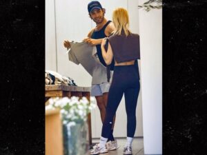 Sam Asghari Oops, I'm Out With the Blonde Again .... Grabs Her Behind During Shopping Date